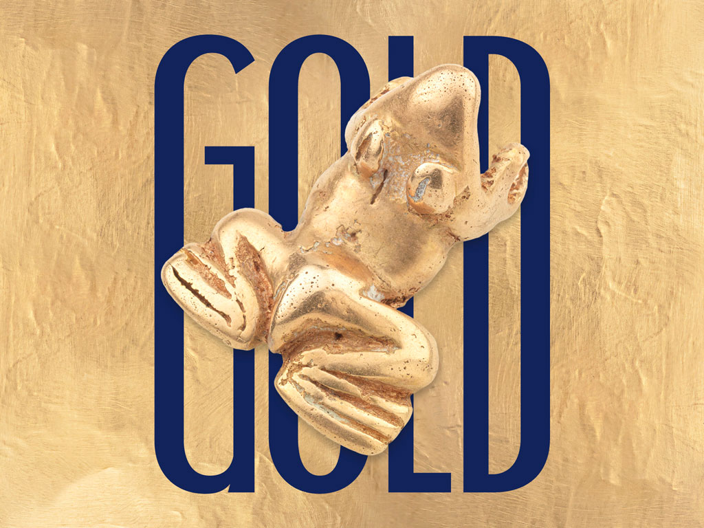 Frog figure made of gold on gold background